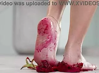 Petite brunette crushes fruits with bare feet and heels in 4k