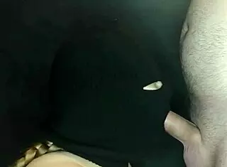 my step sister's hot mouth sucks cock under a hidden balaclava.