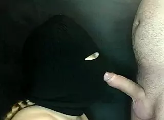 my step sister's hot mouth sucks cock under a hidden balaclava.