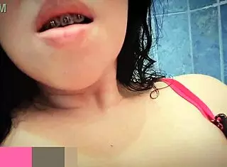 Horny teen masturbates in public bathroom, squirting for the first time.